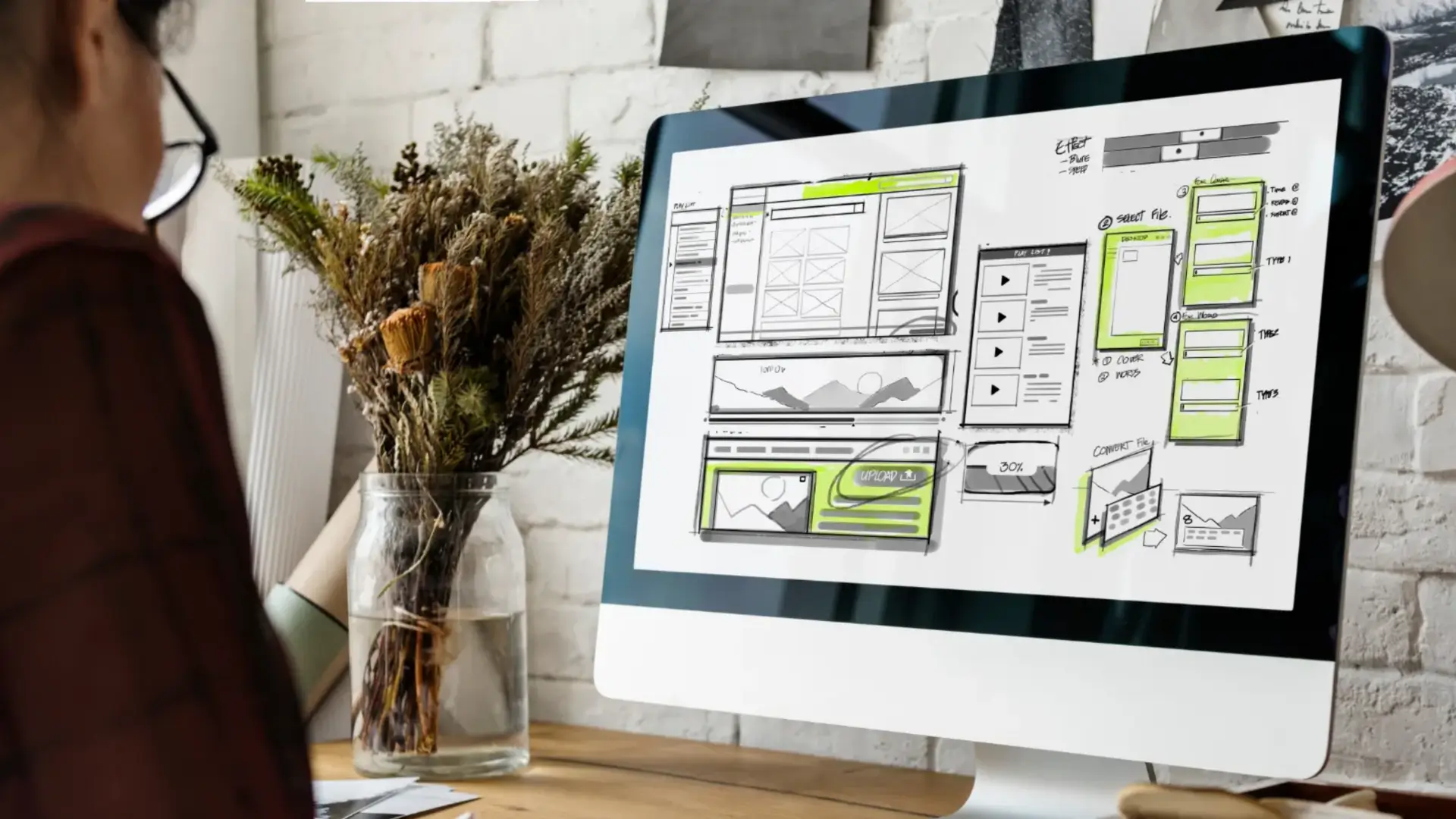 Computer screen displaying different web design blocks illustrating signs of necessary website redesign