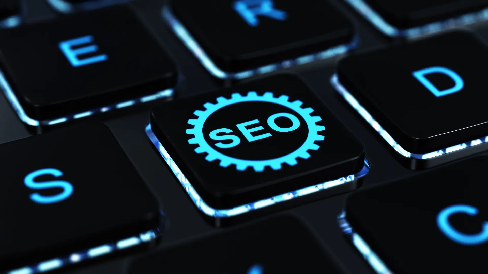Black keyboard backlit in blue, with one key carrying the word SEO set inside a cogwheel